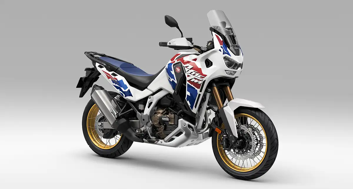 Moto CRF 1100L Africa Twin Adventure Sports com bancos azuis e garfos dourados